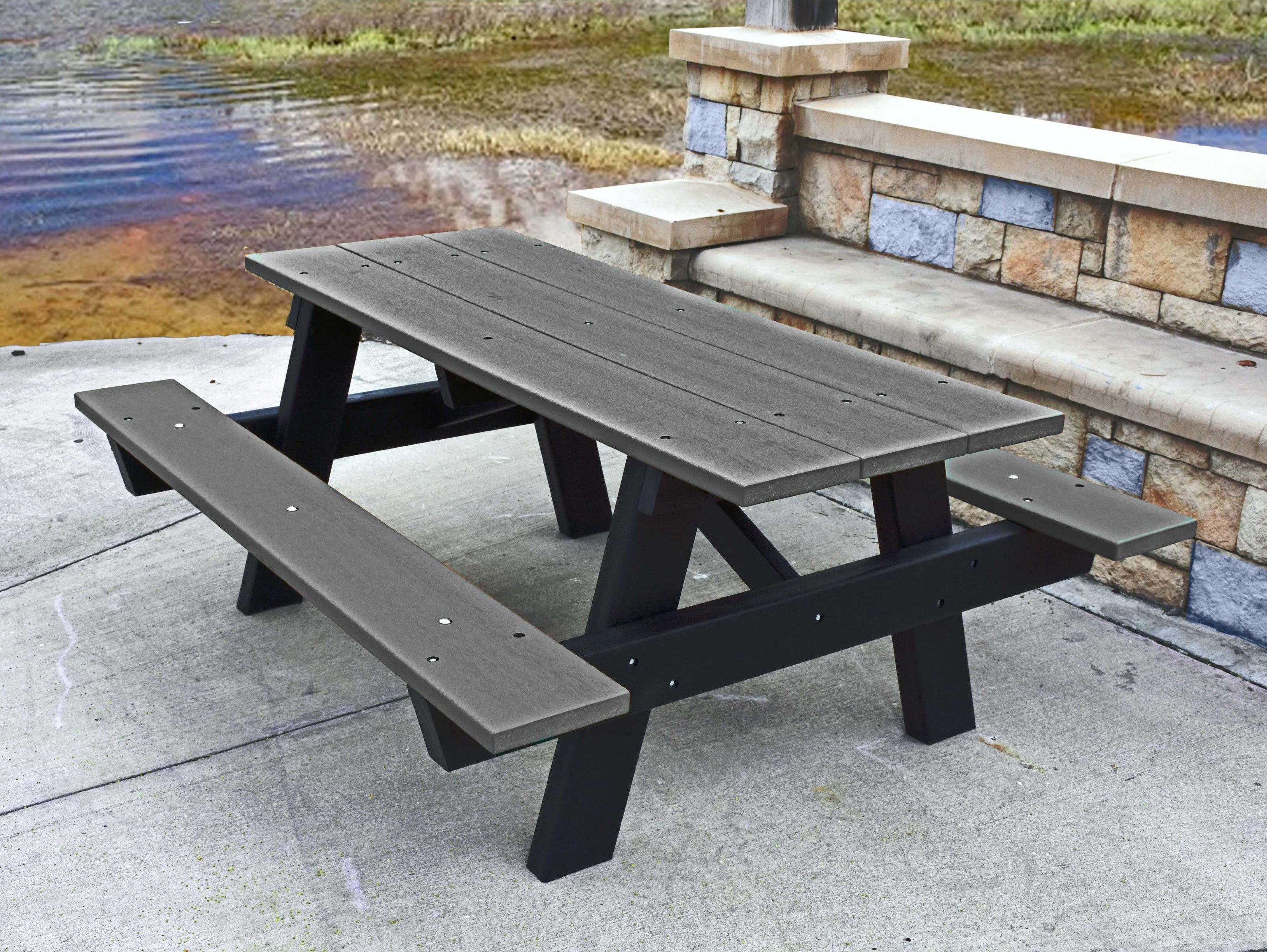 Frog Furnishings Gray A-Frame Picnic Table By Water in National Park