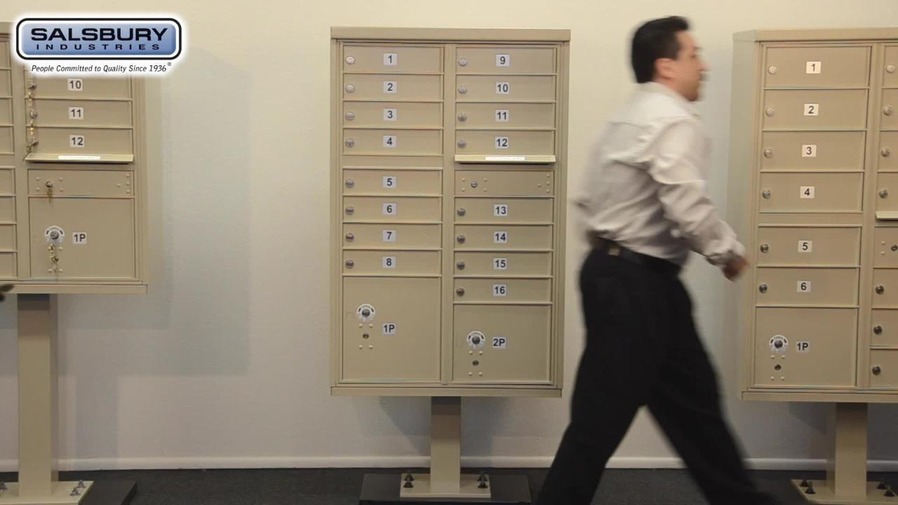 Man Walking by Salsbury USPS Mailbox Cluster Unit with 16 Doors and 2 Parcel Lockers with other mail cluster units