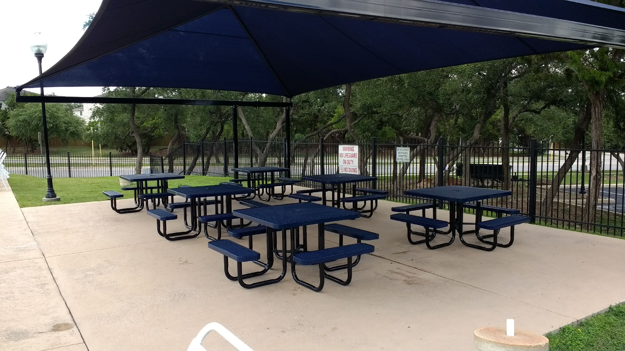 Multiple Navy MyTCoat Square Portable Picnic Tables with Pool Sitting Area Background