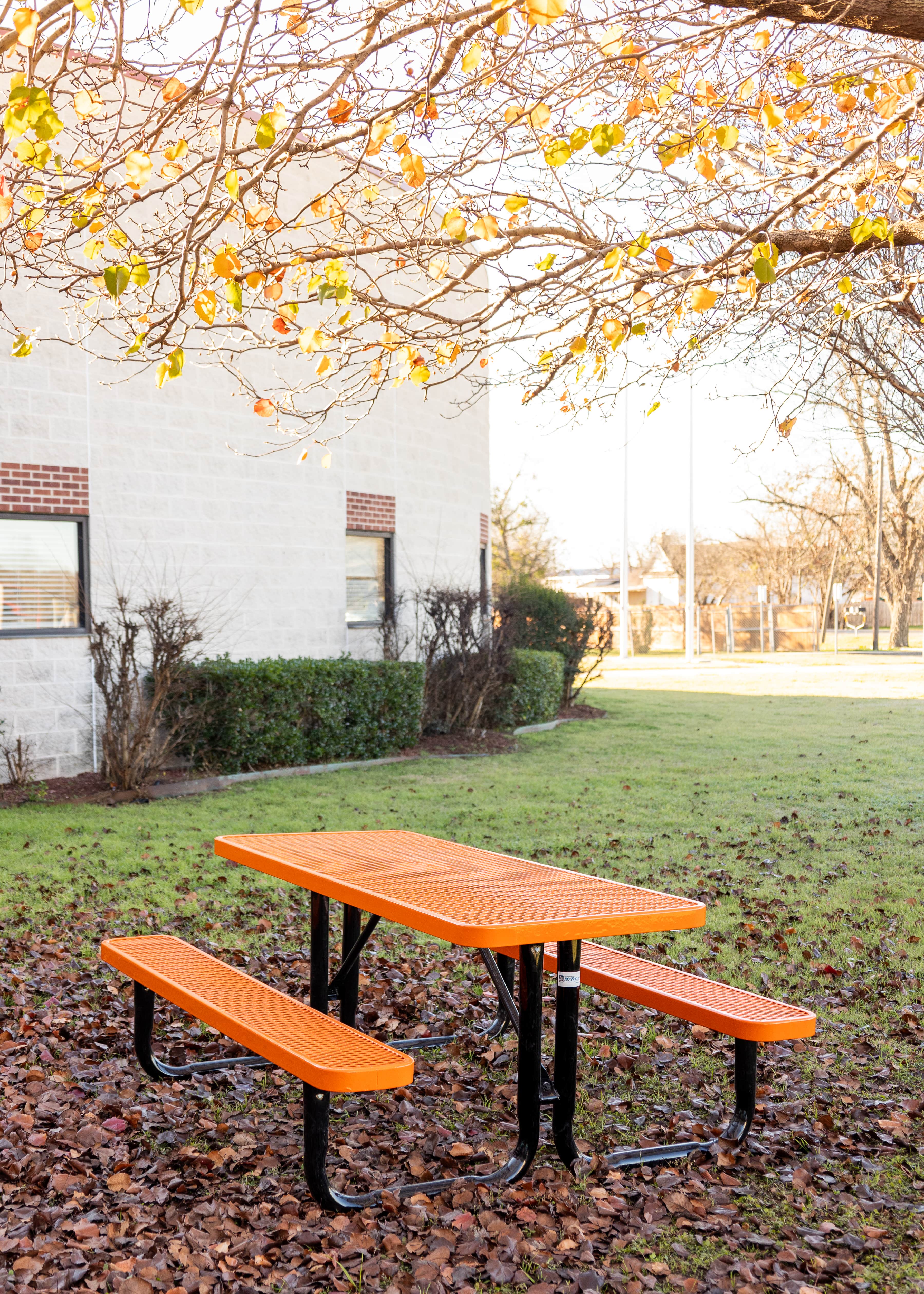 Orange MyTCoat Rectangular Portable Picnic Table in School Field Lifestyle Image