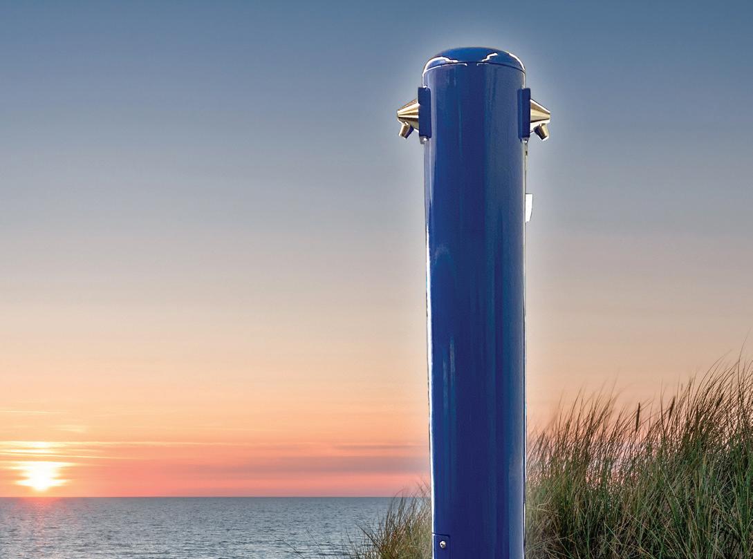 Top Half of Stern-Williams 6200 Outdoor Shower Tower with Foot wash with Sunset Background