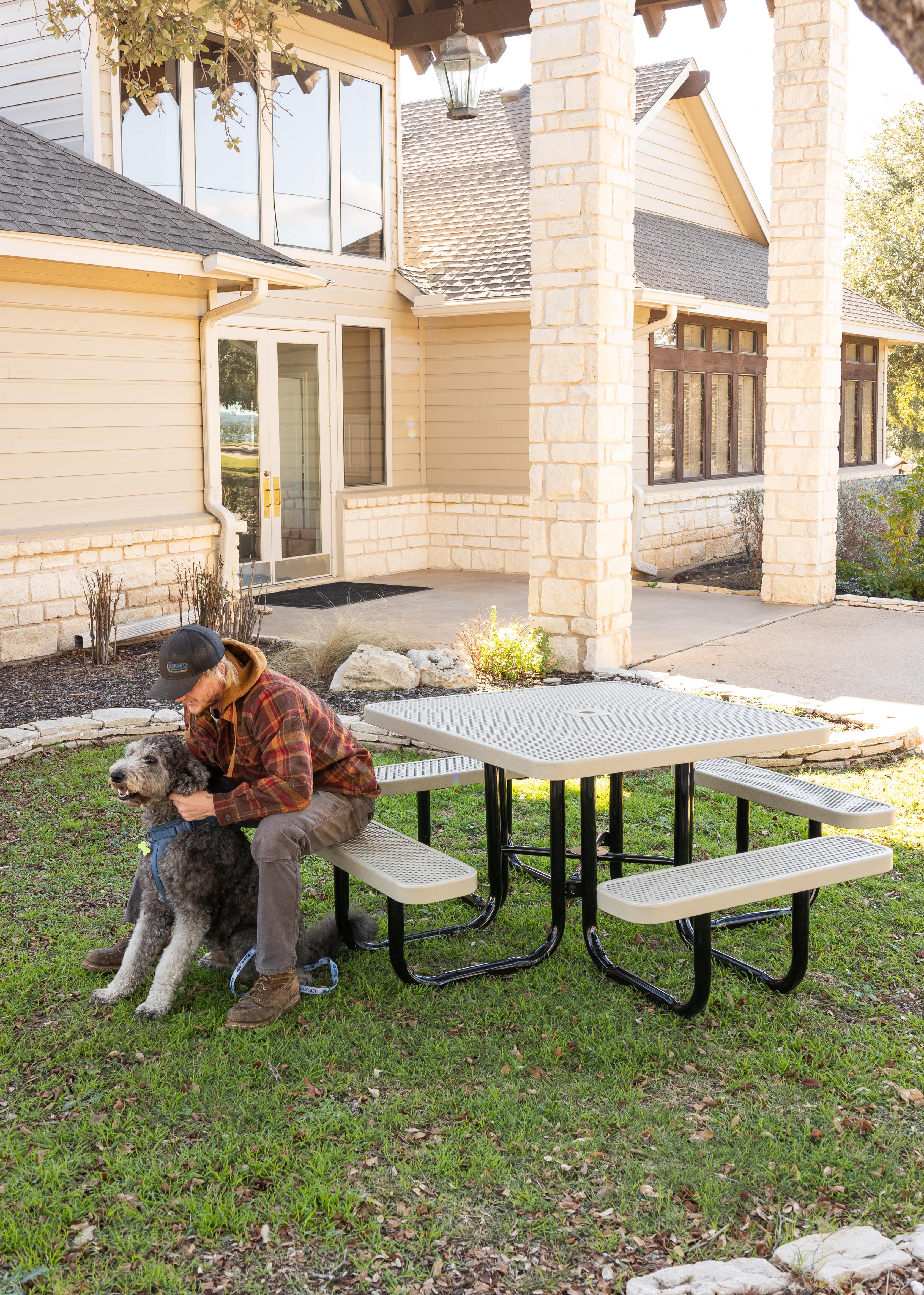 White MyTCoat Square Portable Picnic Table with House Background and Man Sitting With Dog