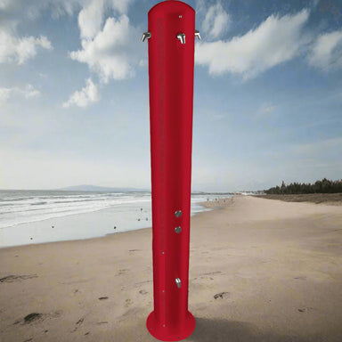 Willoughby Outdoor Shower Tower on a sandy beach with ocean and sky in the background