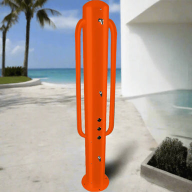 Willoughby Stainless ADA Outdoor Shower Tower on a beach with palm trees and blue sky.