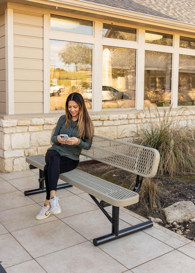Woman Sitting On Gray MyTCoat Metal Outdoor Bench With Backrest Lifestyle Photo