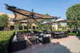 Outdoor patio area with tables, chairs, and USA Shade Solana Cantilevers in outdoor restaurant
