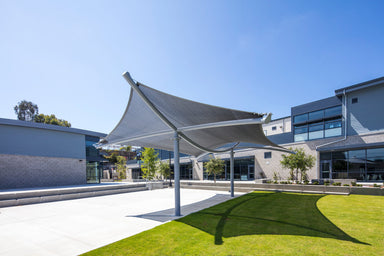 Modern architectural designed USA Shade Aquarius Shade with a large curved roof structure in an urban setting.