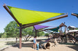 Children playing under a green USA Shade Arbor Shade sail at a playground with a clear blue sky.