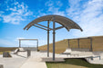 Outdoor seating area with a curved USA Shade Panorama Cantilever under a blue sky