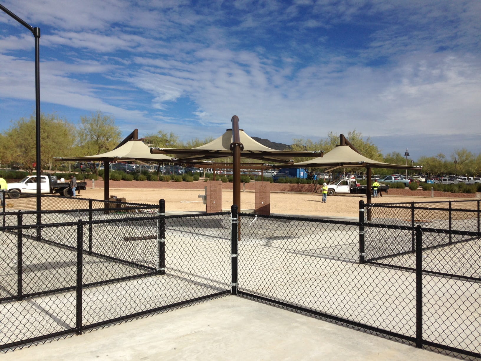 Outdoor pickleball courts with USA Shade Solana Cantilevers and a clear sky
