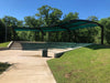 USA Shade Panorama Cantilever in a park setting with trees and clear sky