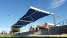 Blue USA Shade Full Hip Cantilever Shades with white frame against a clear blue sky