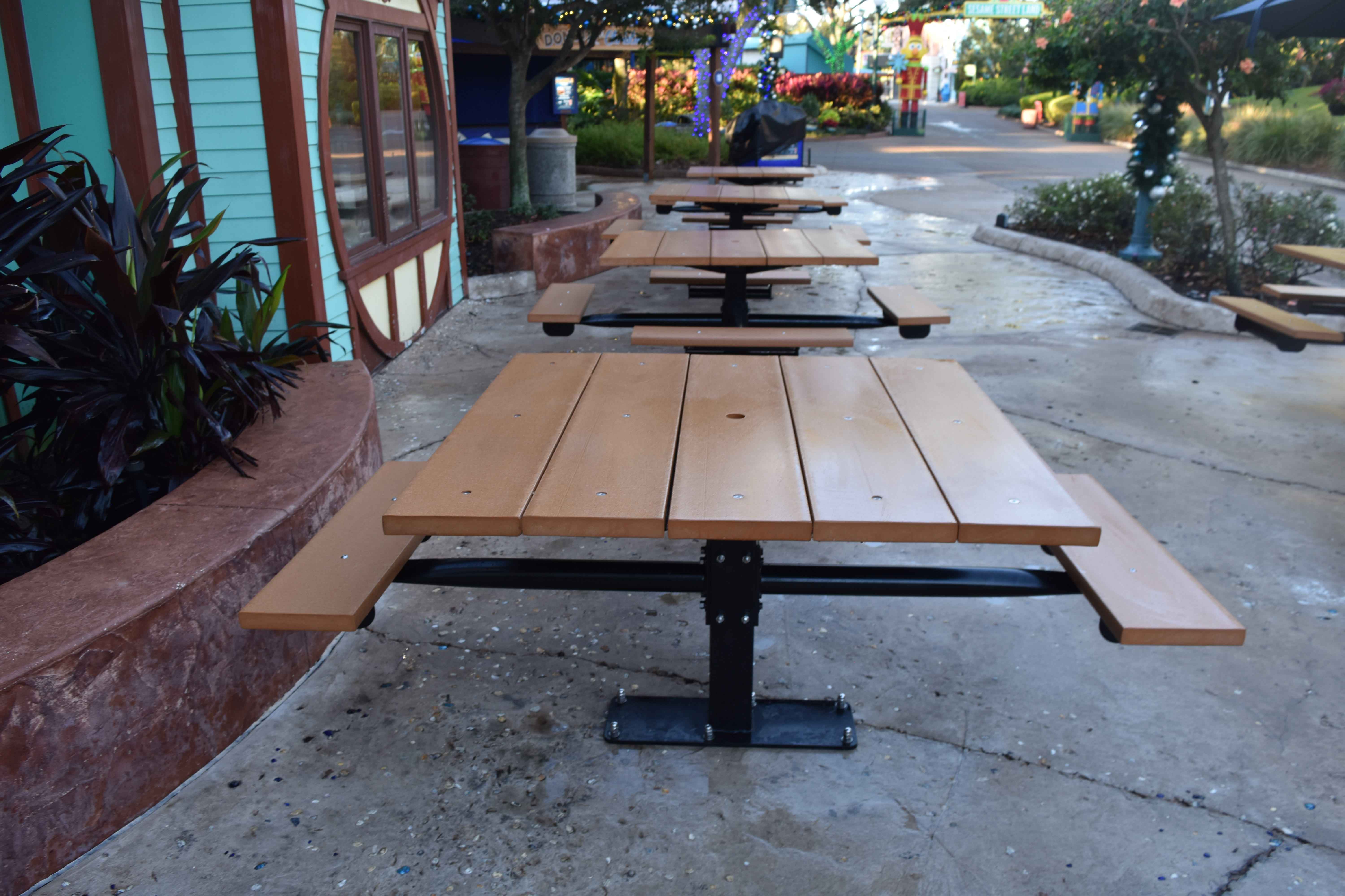 Black Wabash Valley Rinnova Square Picnic Tables with seats on two sides, Surface Mount, a row of food court tables