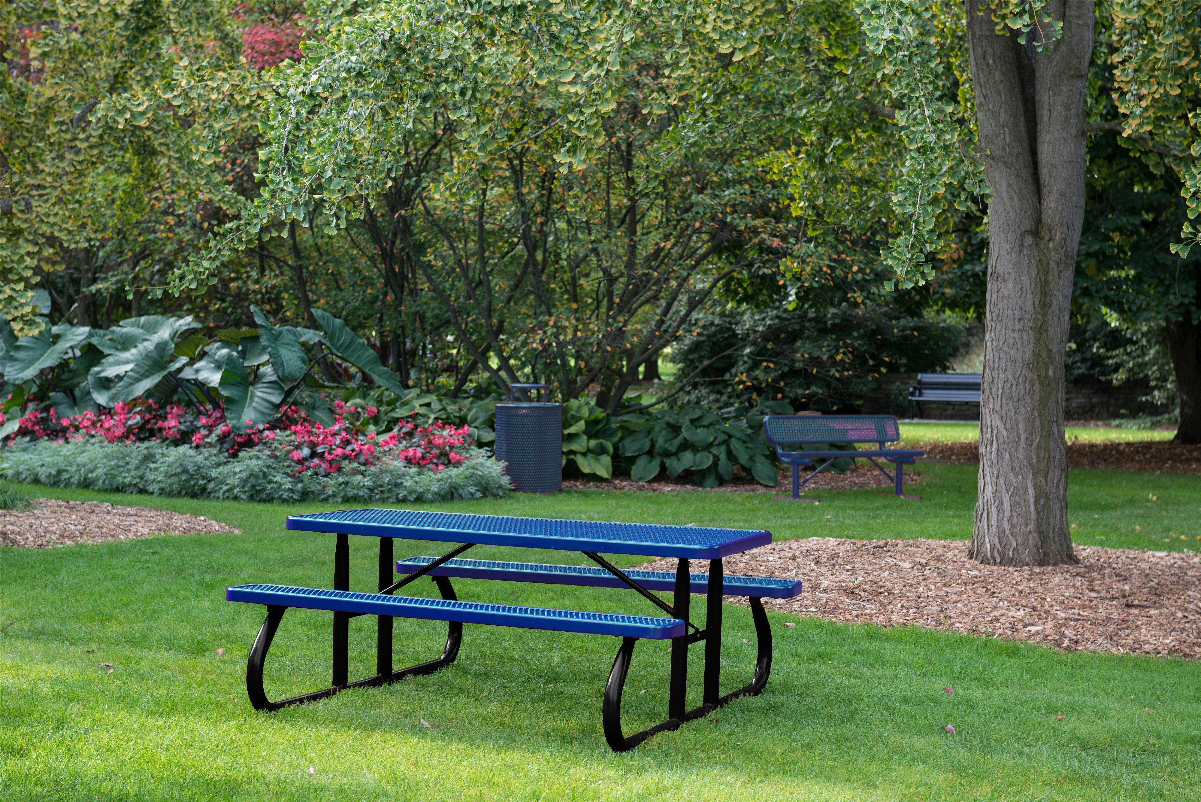 Black & Blue Wabash Valley Signature Portable Picnic Table with a Diamond top and seats on a black frame, set on a park lawn, portable picnic table