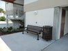 Black Wabash Valley Signature Ribbed Commercial Trash Receptacle Next to Wabash Valley Bench Lifestyle Image