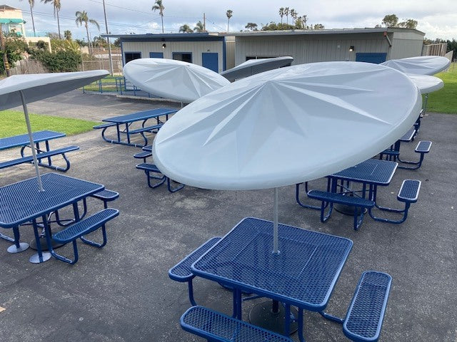 Blue Wabash Valley Signature Square Picnic Table with a Diamond top and an umbrella through the center hole