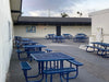 Blue Wabash Valley Signature Square Picnic Tables with Diamond tops in a school courtyard, square tables with benches