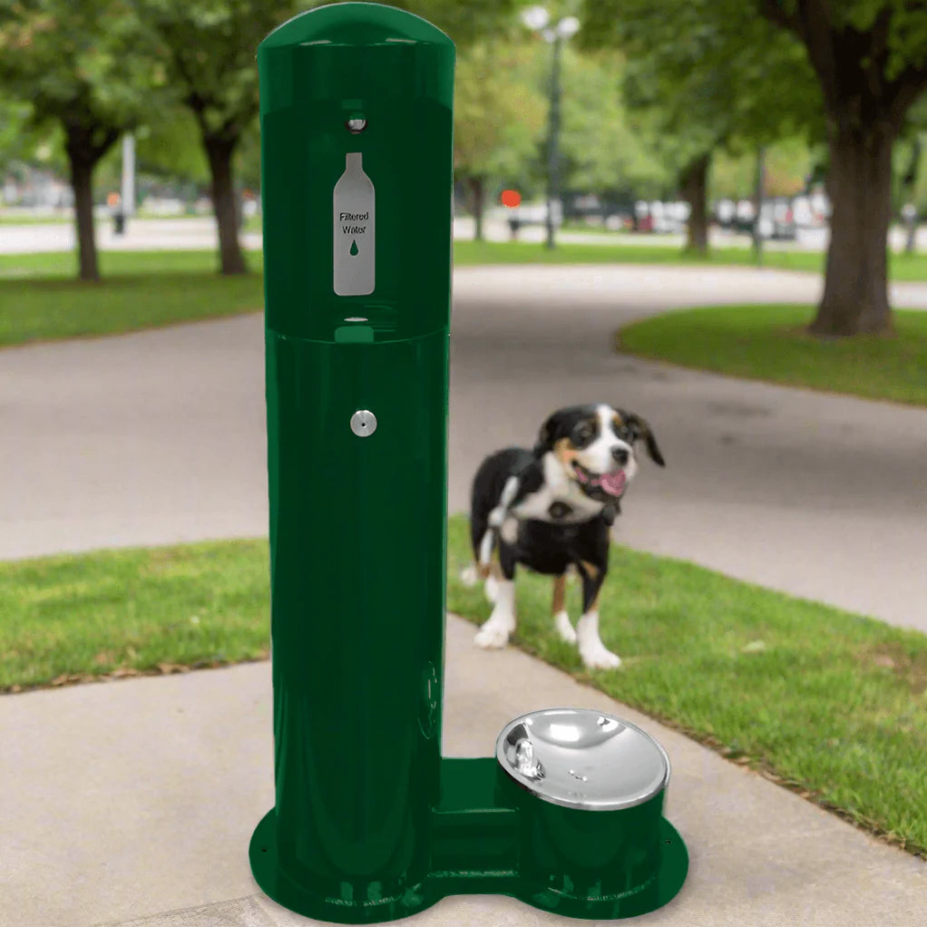 Gray Willoughy Outdoor Water Bottle Filling Station with pet station option and a dog in the background on a sidewalk.