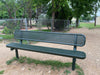 Green Wabash Valley Signature Steel Bench, Perforated seat and back, Inground legs, at an elementary school play area, commercial benches