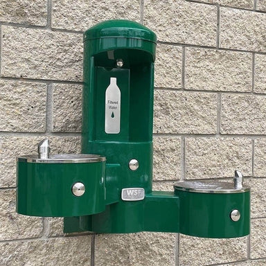 Green Willoughby Wall-Mounted Water Bottle Filling Station with 2 Drinking Fountains on Brick wall Lifestyle Image
