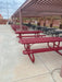 Red Wabash Valley Signature Portable Picnic Tables with Diamond tops under a shade structure in a school courtyard, outdoor school lunch tables