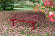 Red Wabash Valley Signature Steel Bench, Diamond seat and back, portable frame with braces, in an autumn garden, outdoor metal bench