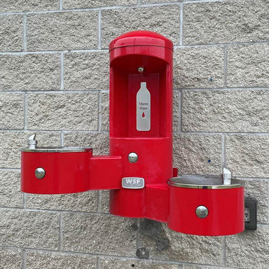 Red Willoughby Wall-Mounted Water Bottle Filling Station with 2 Drinking Fountains on Brick wall Lifestyle Image