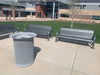 Silver Wabash Valley Contemporary Perforated Steel Benches Surface Mount with matching perforated trash receptacle on a high school campus plaza
