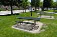 Wabash Valley Signature Portable Picnic Tables with green Diamond tops on tan frames, set on concrete pads in a town park, coated metal picnic table