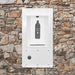 White Willoughby In-Wall Bottle Filler Front mounted on a stone wall