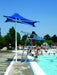 People enjoying a pool day with a blue USA Shade Lifeguard Umbrella and lifeguard stand.