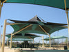 Green USA Shade Multi-Layer Super Span Pyramid Shade structures at a park with clear blue sky