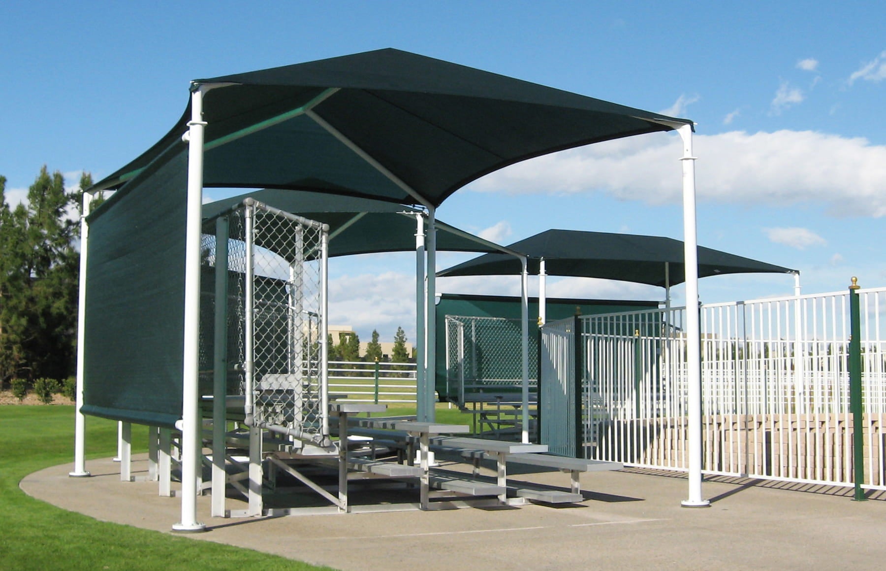 USA Shade Hips with green fabric covering Bleachers on a sunny day.