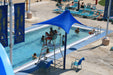 People enjoying a pool with a lifeguard stand and blue USA Shade Lifeguard Umbrella, featuring Central Florida Aquatic Center branding.