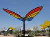 Colorful USA Shade Butterfly Wings Shade in a park setting with clear blue sky