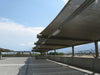 Long USA Shade Slanted Cantilever Cabled in parking lot with a clear blue sky