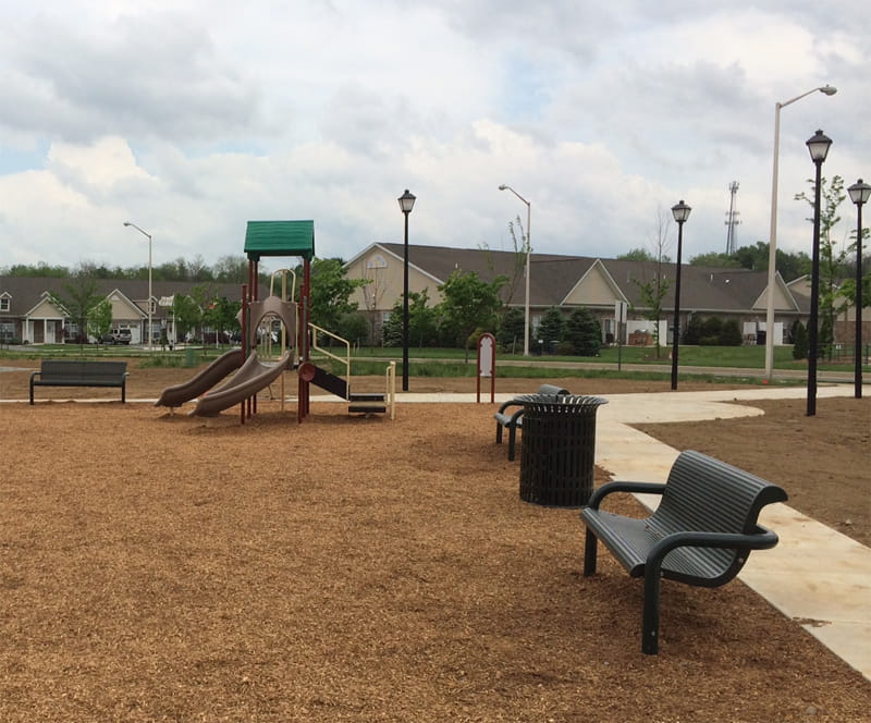 inground mounted Wabash Valley Contemporary Steel Bench at playground