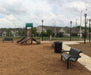 inground mounted Wabash Valley Contemporary Steel Bench at playground