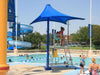 Lifeguard tower with a blue USA Shade Lifeguard Umbrella at a pool with children playing.