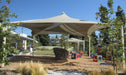 Large outdoor USA Shade Mariner Pyramid Shade structure with trees and garden elements in the background