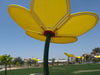 Yellow USA Shade Flower Shade Structure against a clear blue sky