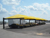 Row of cars under yellow USA Shade Full Hip Cantilever Shades on a clear day