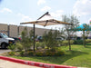 Outdoor USA Shade Solana Cantilever over a garden area with cars and a building in the background